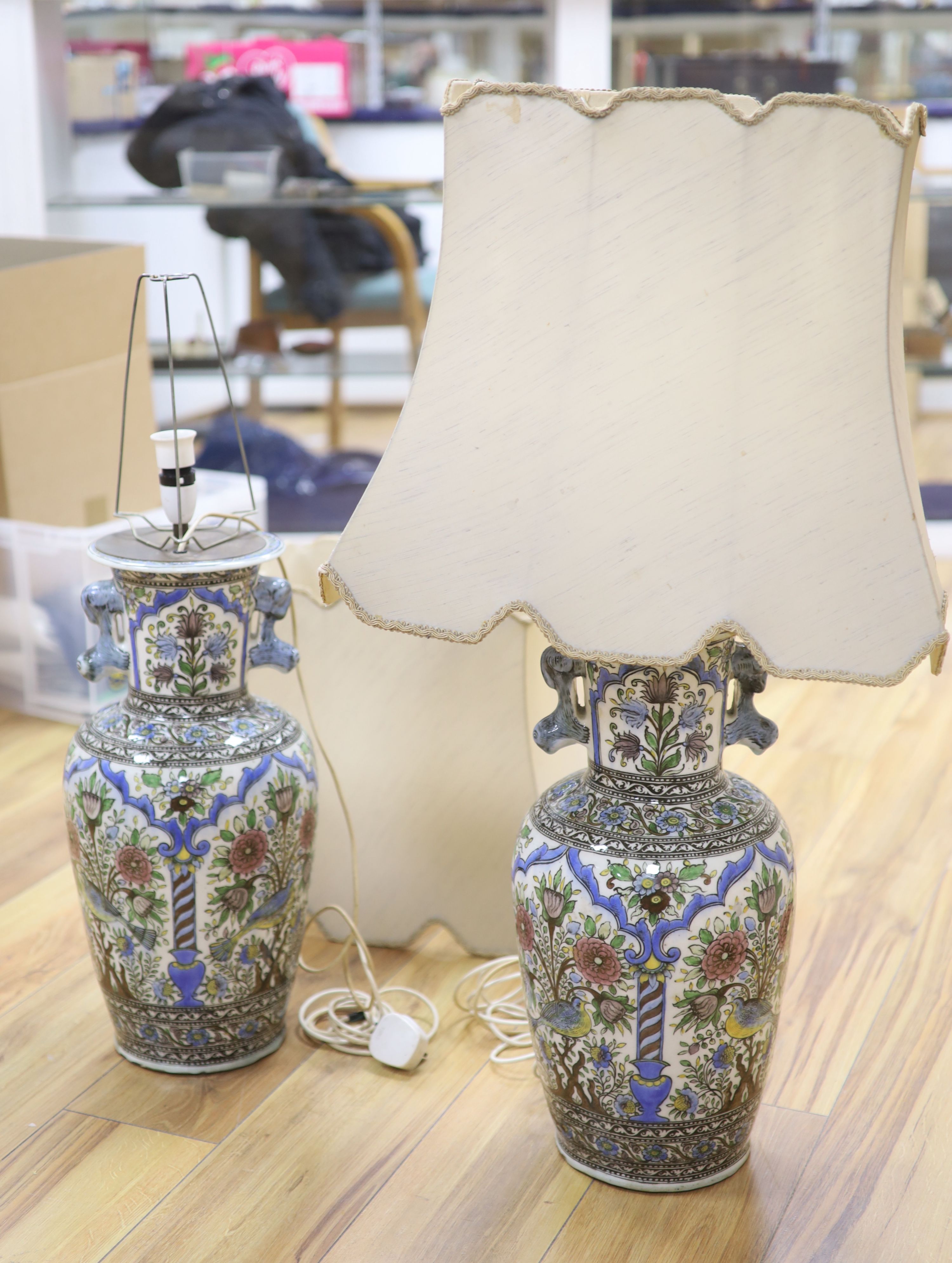 A pair of modern Persian-style pottery vases, fitted as table lamps, height 50cm